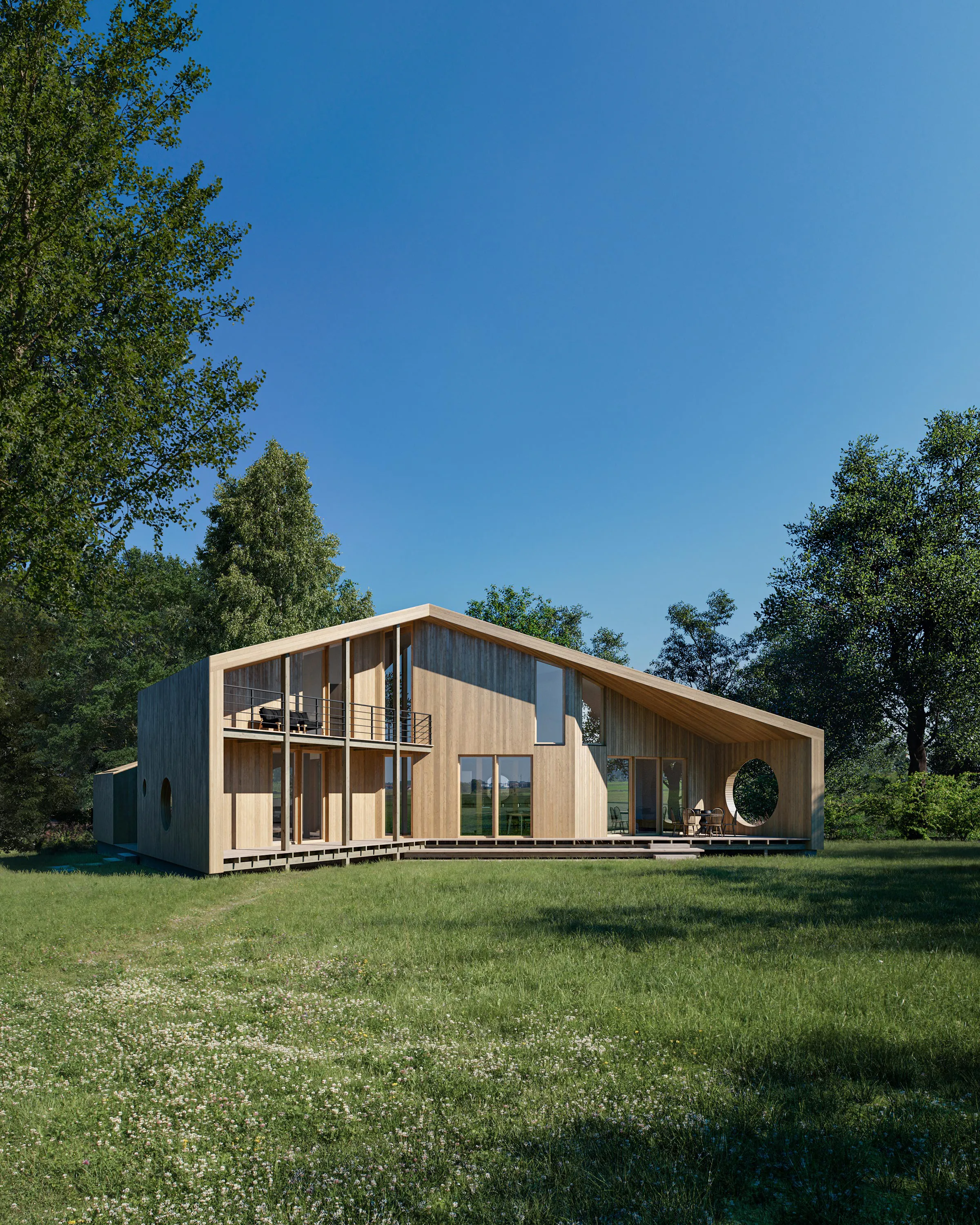 The Wing House in a summer meadow, its pale timber volume under a long sweeping roof with a first-floor balcony.